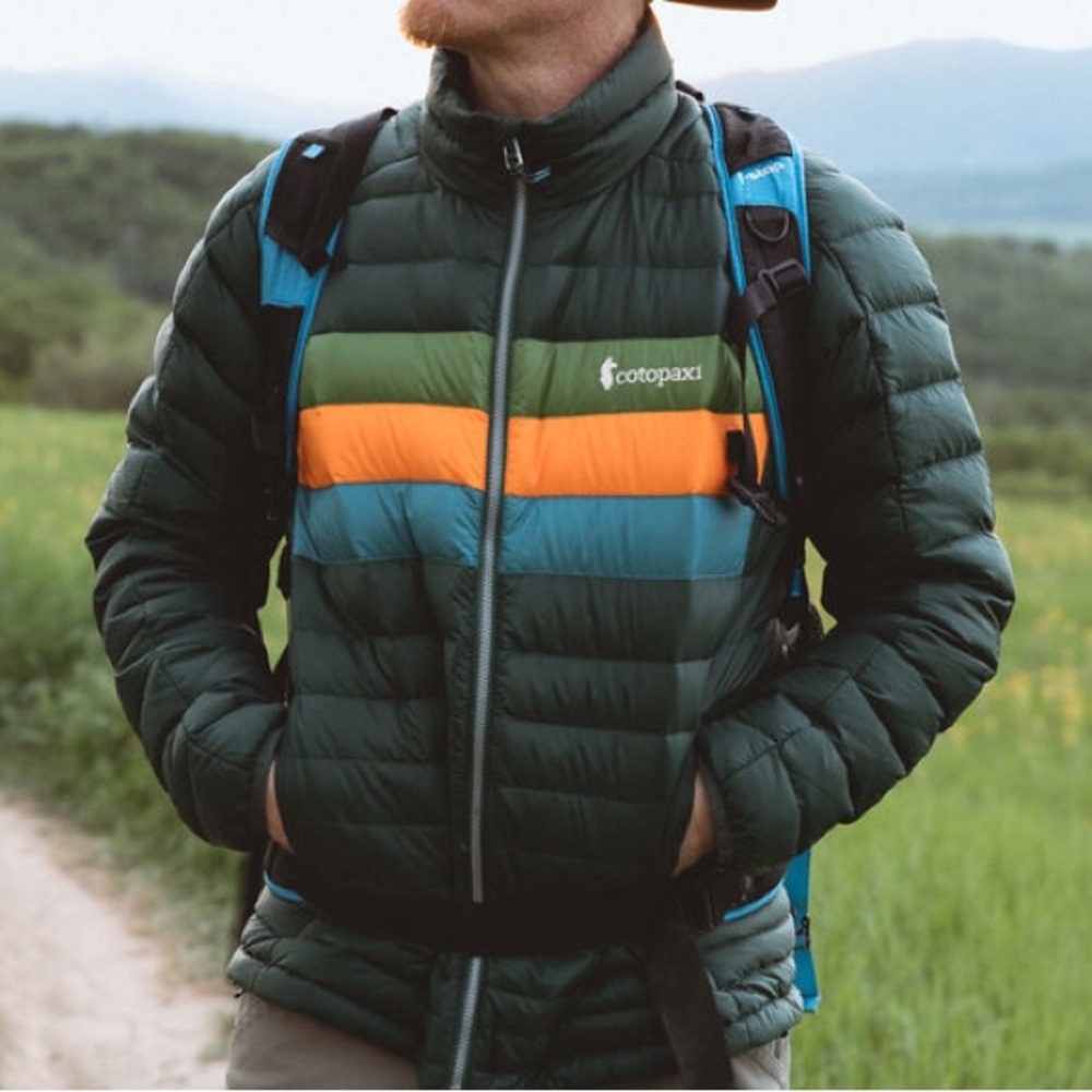 cotopaxi Forest Green Puffer Jacket with Orange, Teal, and Olive Stripes